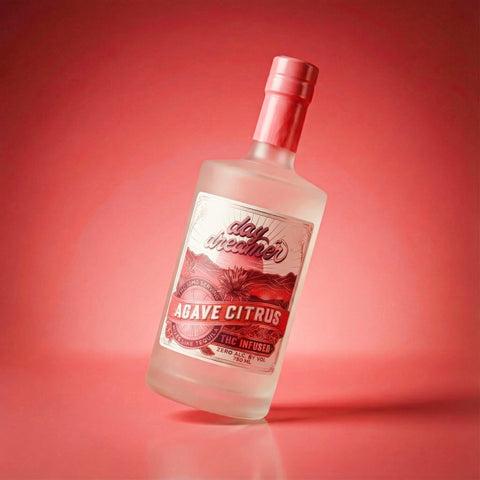 Bottle of Day Dreamer Agave Citrus on a red background