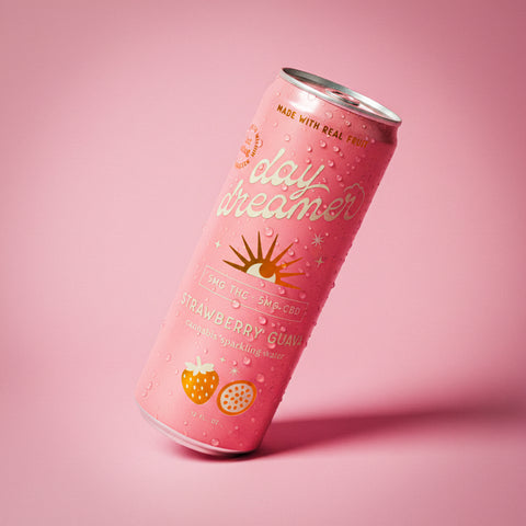 Pink can of 'day dreamer' strawberry guava sparkling water on a pink background