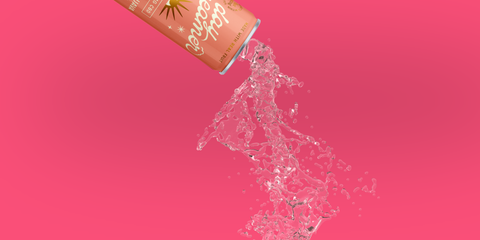 a pink and white can of Day Dreamer Cannabis sparkling water pouring out in front of a pink background